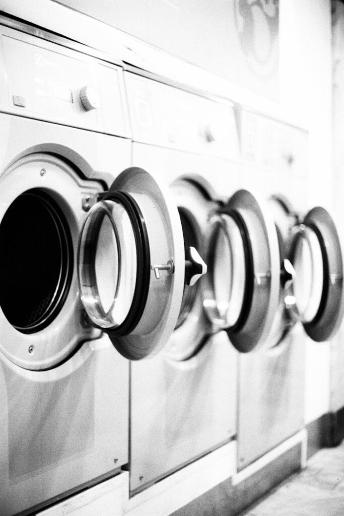 Grayscale Photo of Washing Machine